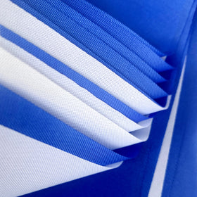 Outdoor wedding decor using LoveVC pennant banner in blue and white.