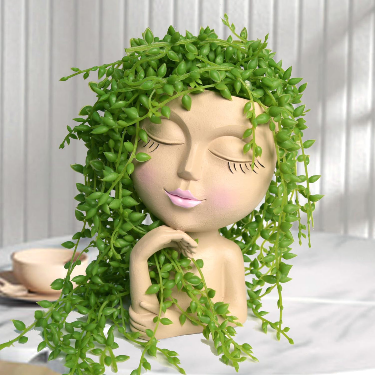LovTocTic Face Planter with a smiling head, perfect for brightening shelves.