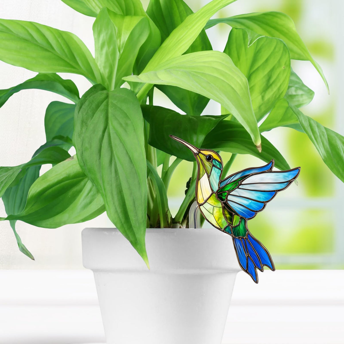 LRPBQFV multicolor bird stake creates whimsical focal points among blooms