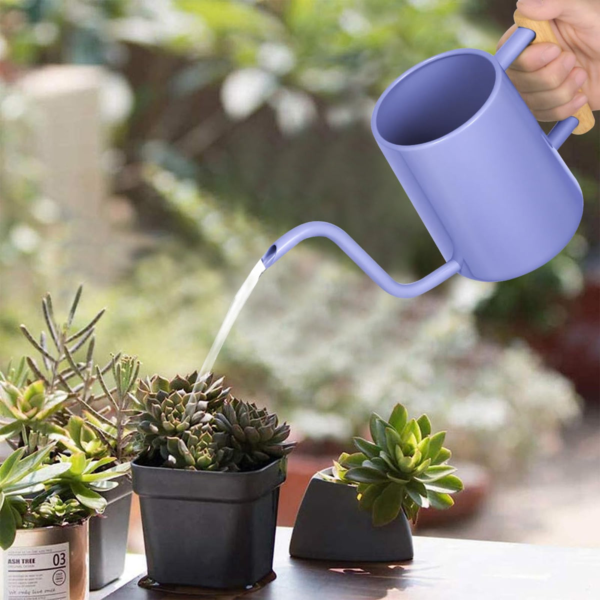 LTSUMI watering can featuring a wooden handle for comfortable grip.