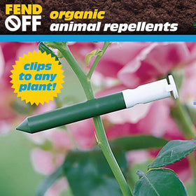 Luster Leaf DR-50 garlic-oil odor-release clips scenting a flower bed
