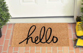 LuxUrux Hello doormat at an entryway setup emphasizing welcoming vibe