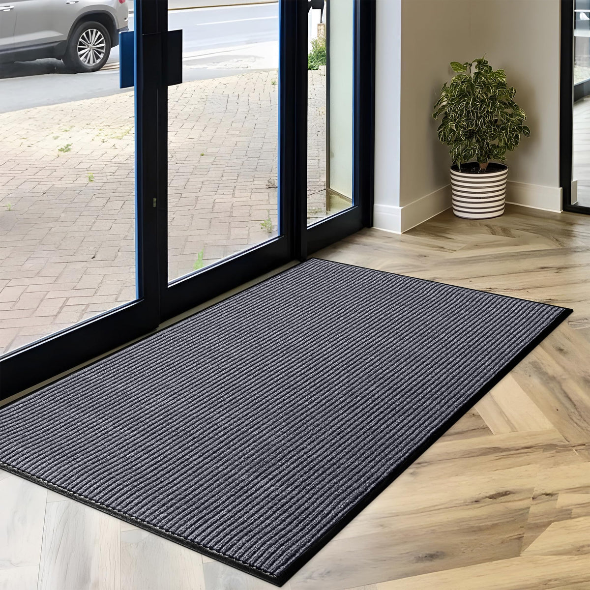 LuxUrux mat backing prevents shifting for safer busy doorways.