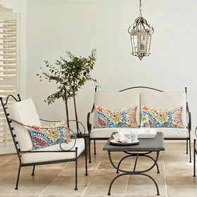 LVTXIII decorative pillow on a patio sofa adds inviting ambiance.