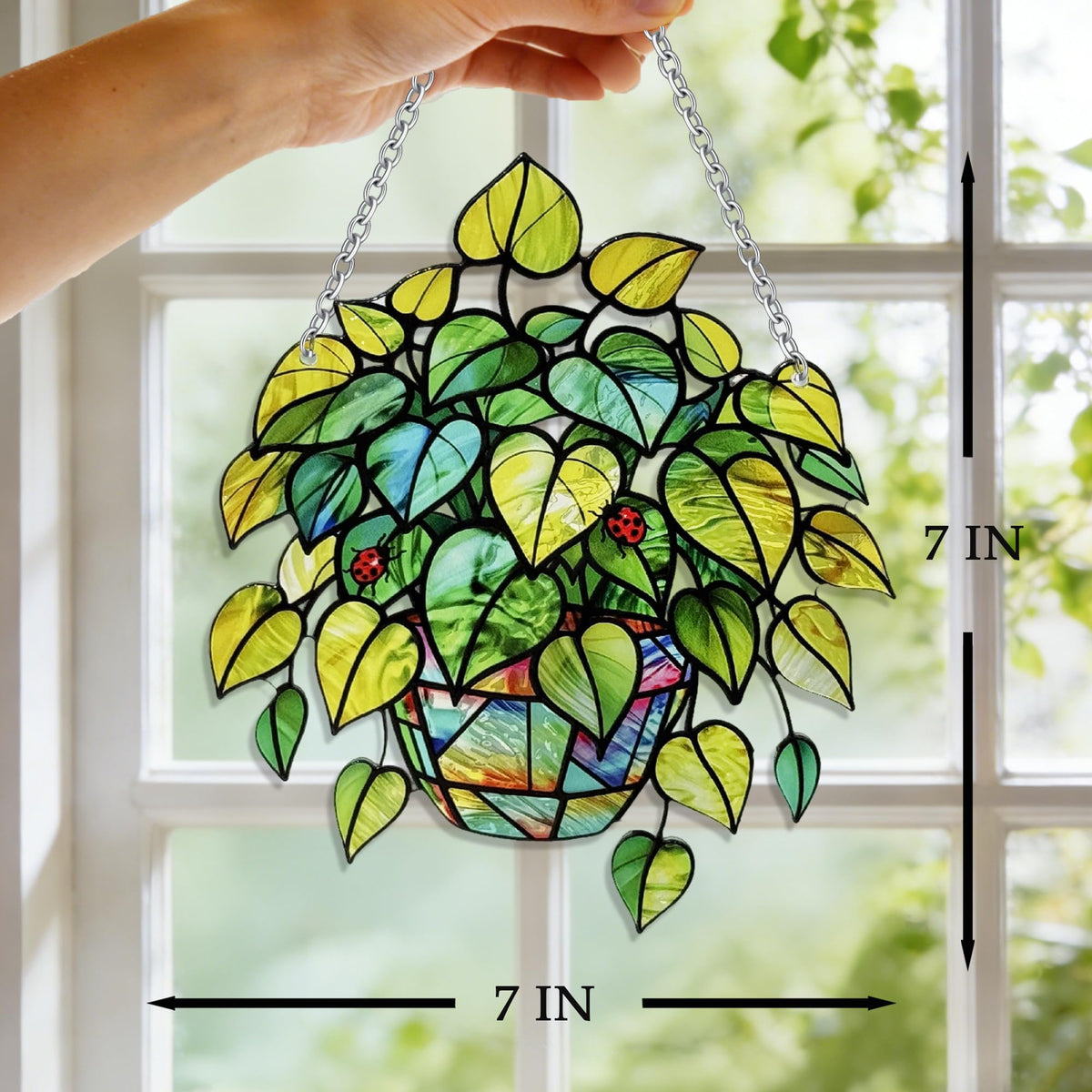 LXTMMRLJQ stained glass suncatcher in window creates rainbow color spots