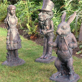 Lycss Cheshire Cat statue creates a curious outdoor focal point.