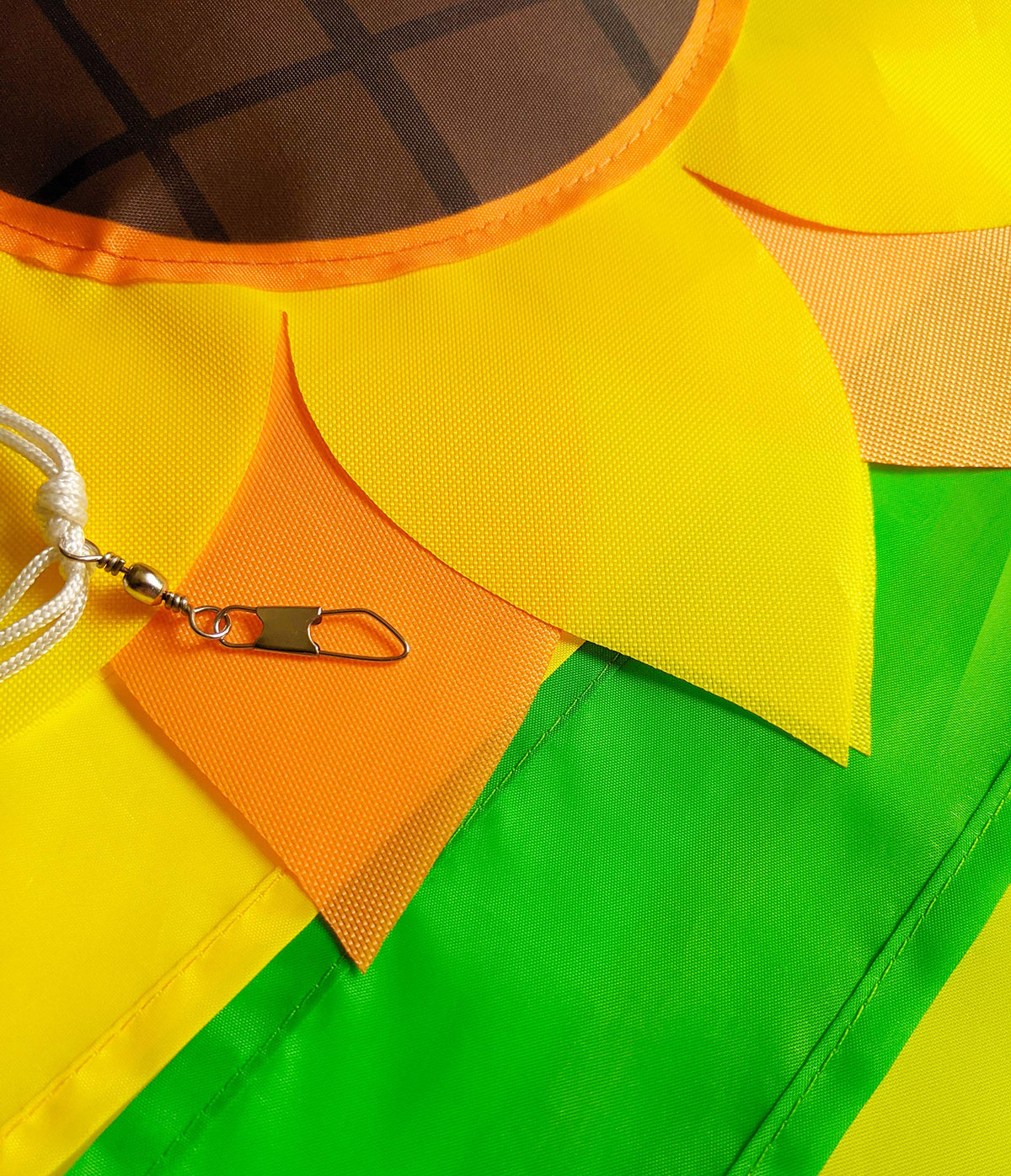 Green and yellow tails on Madrona Brands windsock catch breeze beautifully