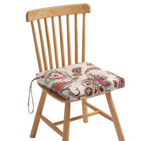 Makimoo khaki floral cushion on wicker chair sunlight