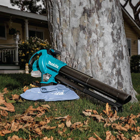 Makita XBU07Z mulcher blade shredding leaves into fine mulch.