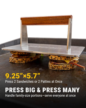Manucode bacon press in use on a hot griddle with burgers