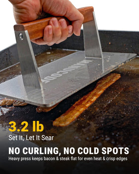 Manucode press with wooden handle stays cool during cooking
