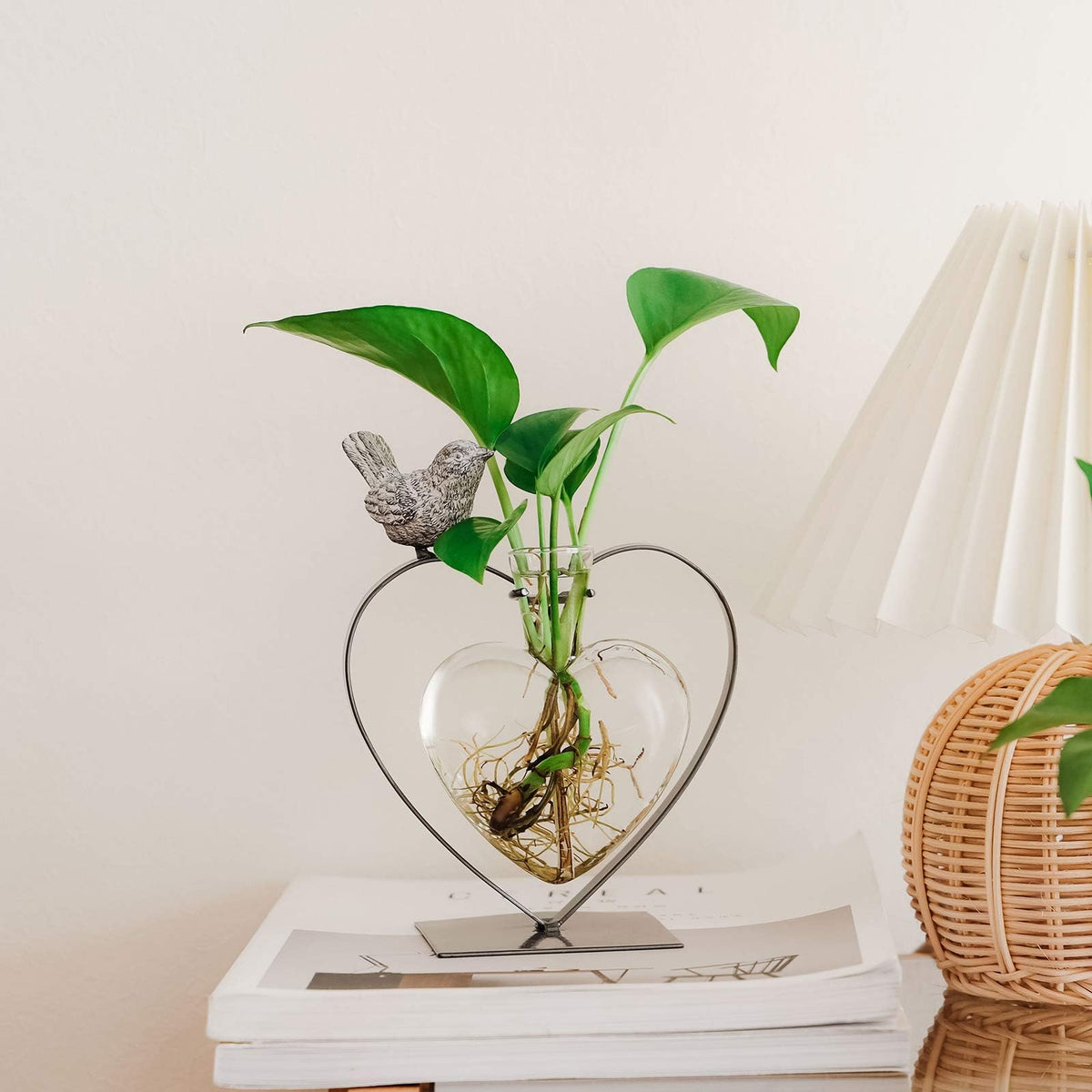 Marbrasse metal stand elevates the vase for a striking centerpiece.