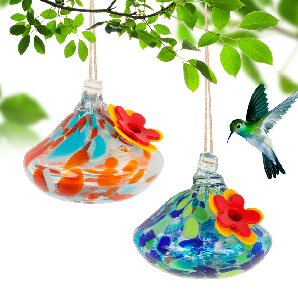 MARCHROSE glass hummingbird feeder outdoors round with red ports, attracts hummingbirds.