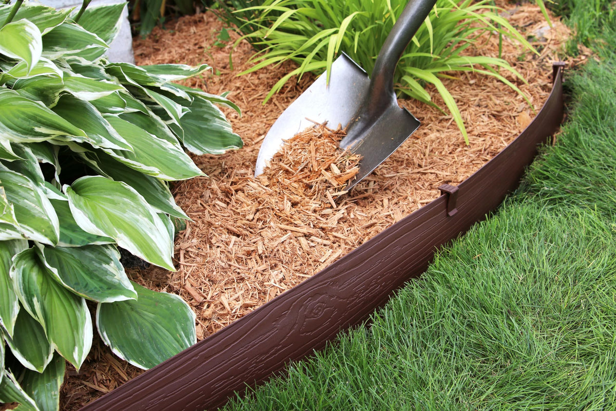 Master Mark edging creates raised mulch or rock layers for neat beds.
