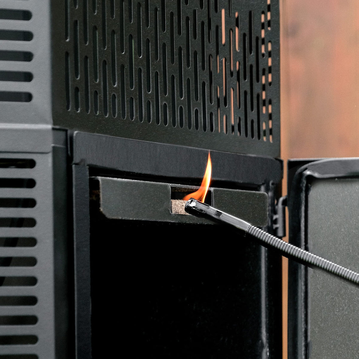 Masterbuilt gravity-series compatible fire starters shown near charcoal grill