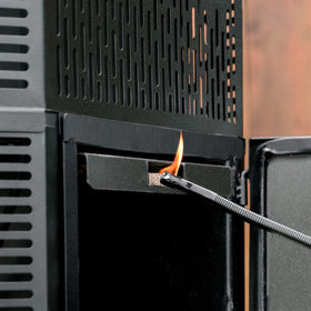 Masterbuilt gravity-series compatible fire starters shown near charcoal grill