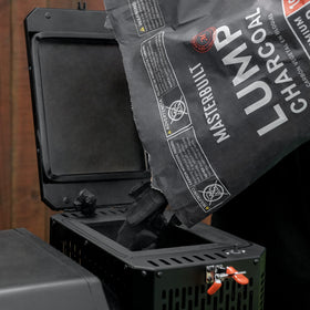 Masterbuilt lump charcoal on a grill delivering authentic flavor across temps.