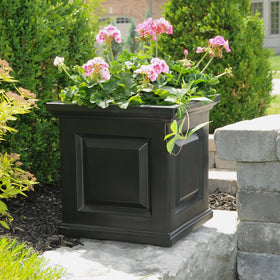 Mayne Nantucket 16-Inch Planter pictured on a patio for flowers.