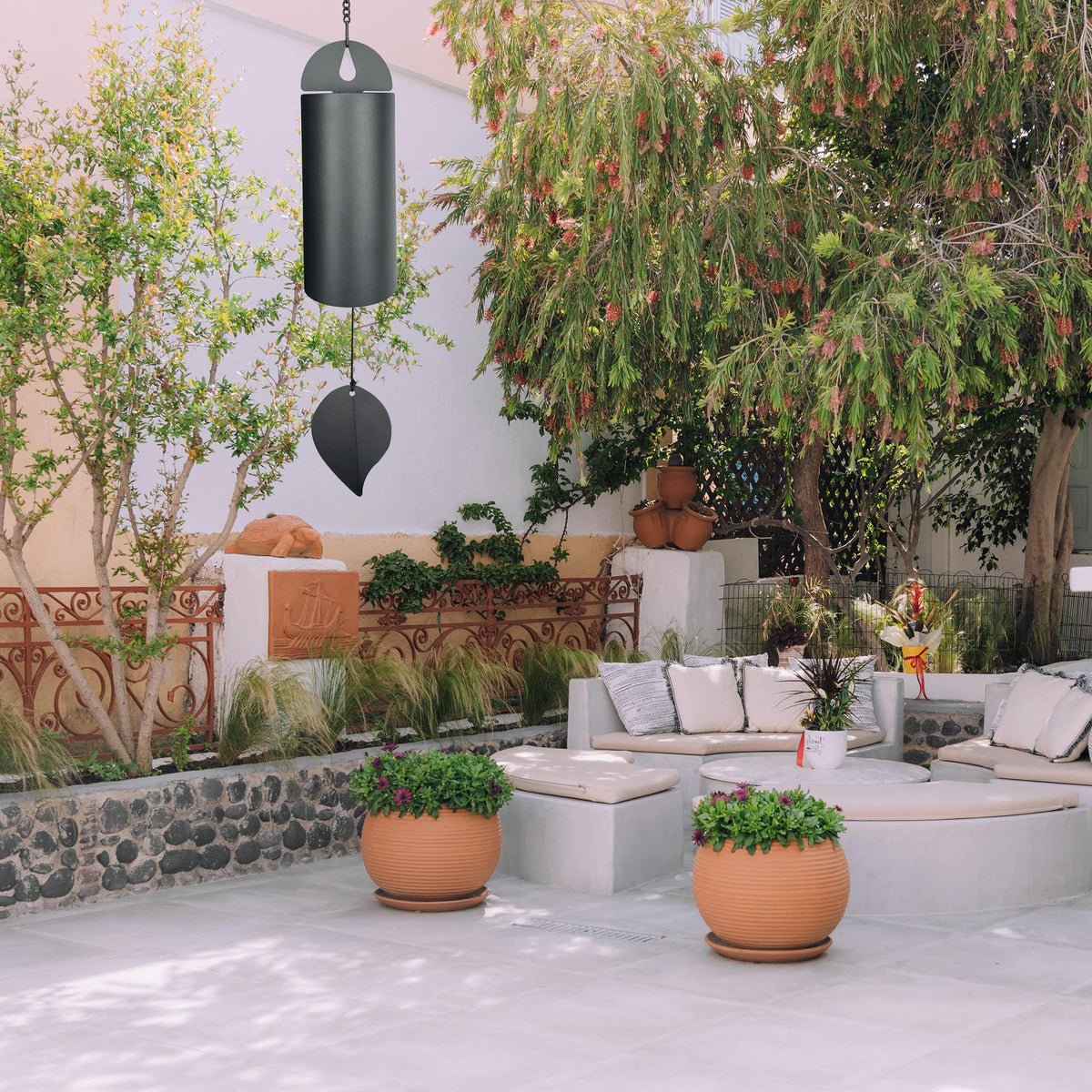 MEDOO Black steel wind chime enhances garden decor with subtle breeze.