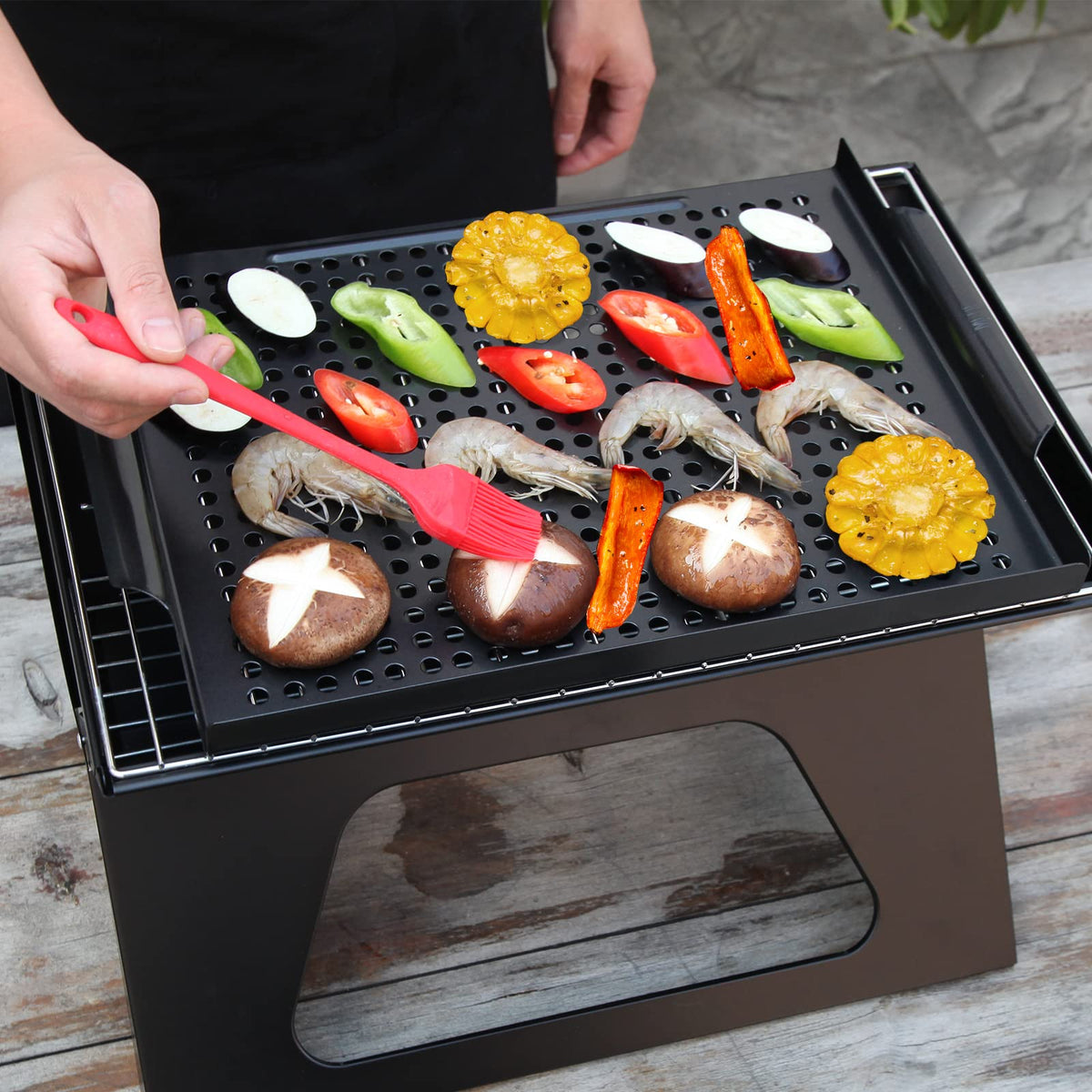 MEHE grill basket with vegetables on grill showing even cooking