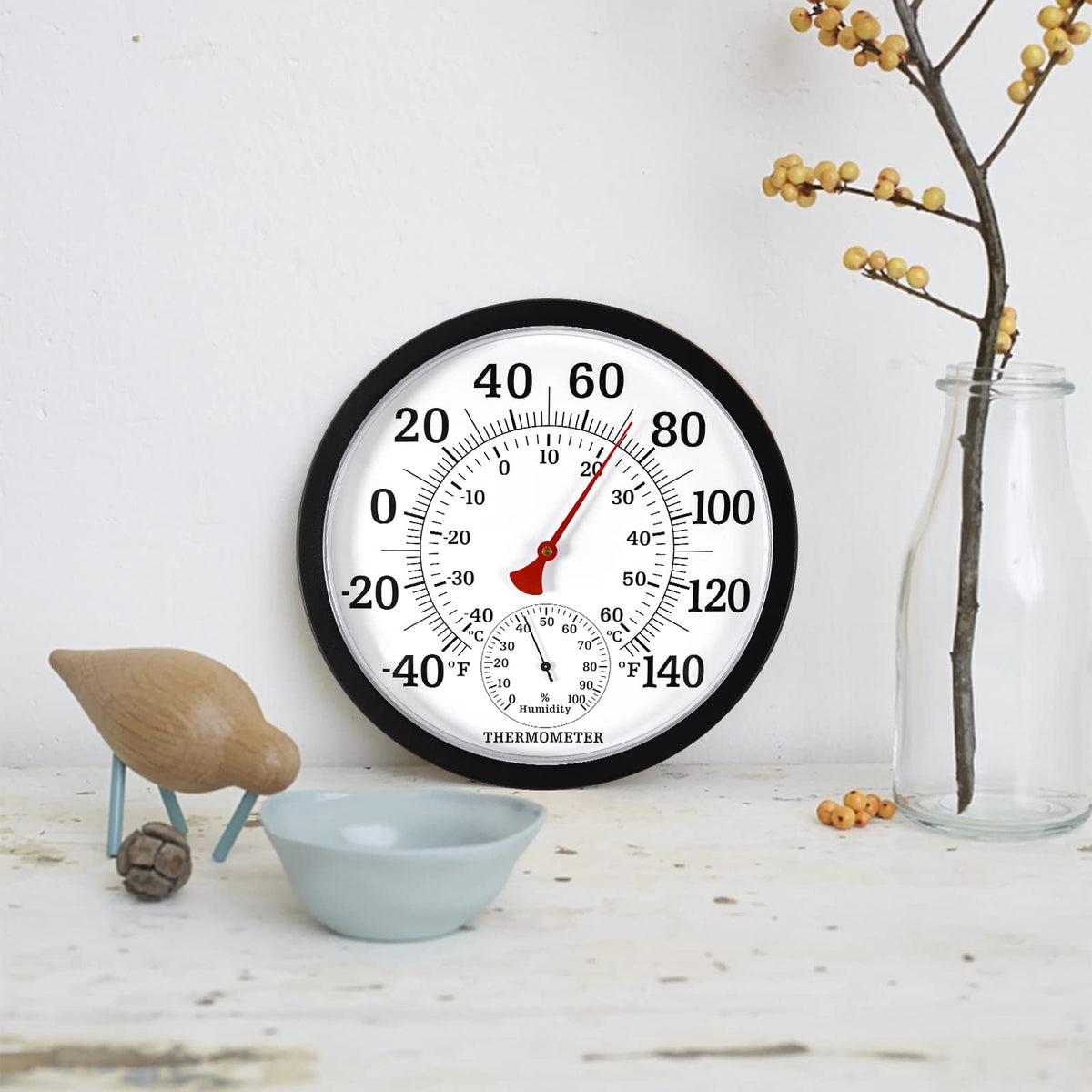 MEINV black outdoor thermometer complements modern exteriors while tracking temperature and humidity.