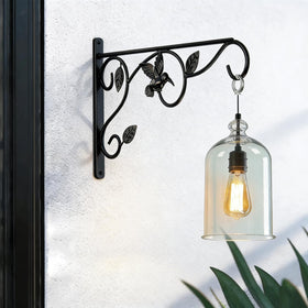 Mekpiwu black finish wall hook paired with lanterns for patio ambiance.
