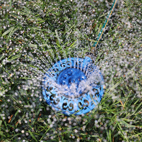 Melnor decorative metal base stabilizes the sprinkler on uneven ground