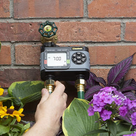 Melnor HydroLogic dual-zone setup image showing independent schedules for lawn and garden.