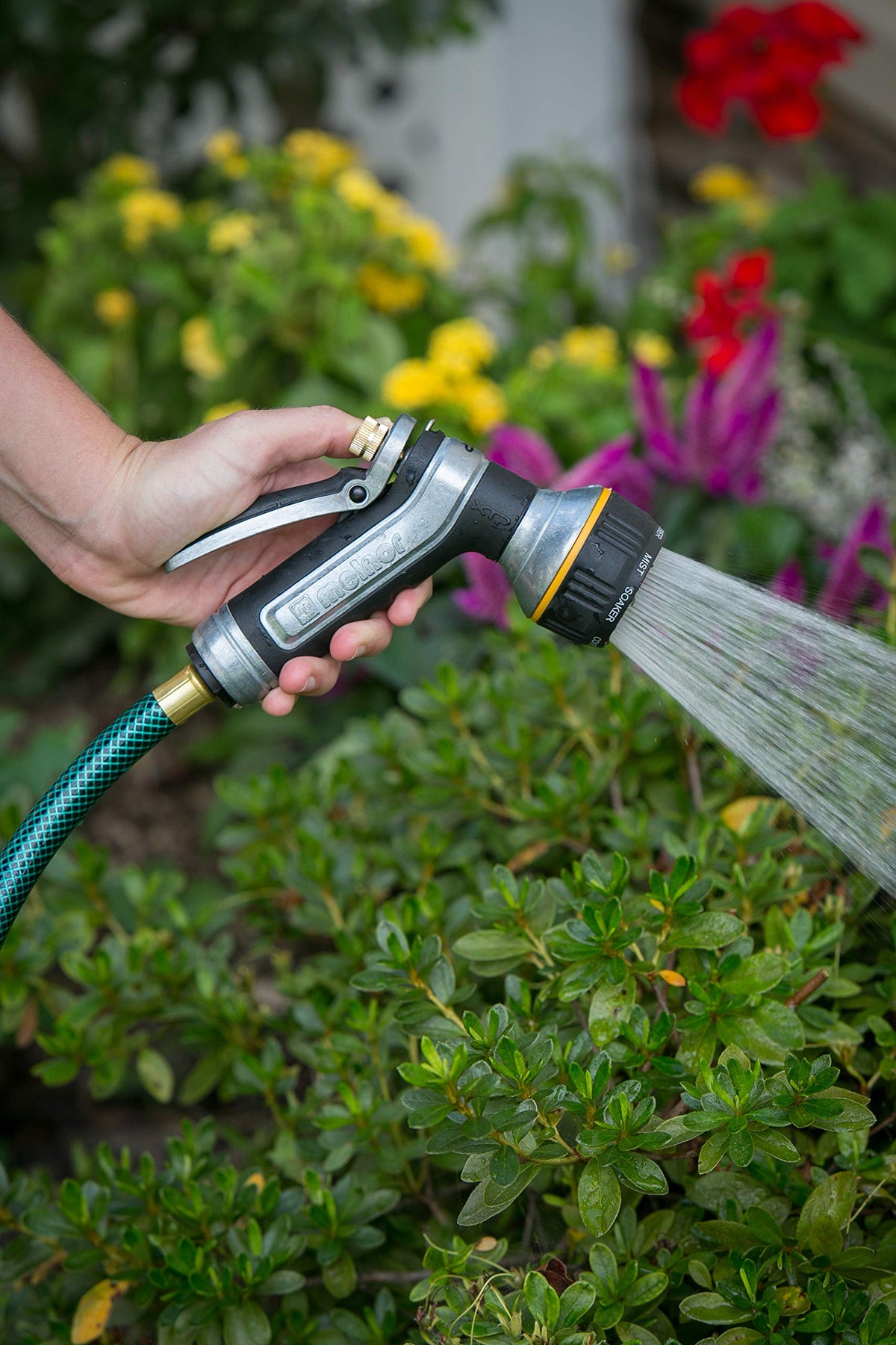 Melnor metal nozzle rear trigger grip provides comfortable control during long watering sessions.