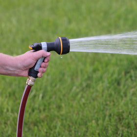 Melnor thumb-control nozzle showing ergonomic, slip-resistant grip for comfortable watering.