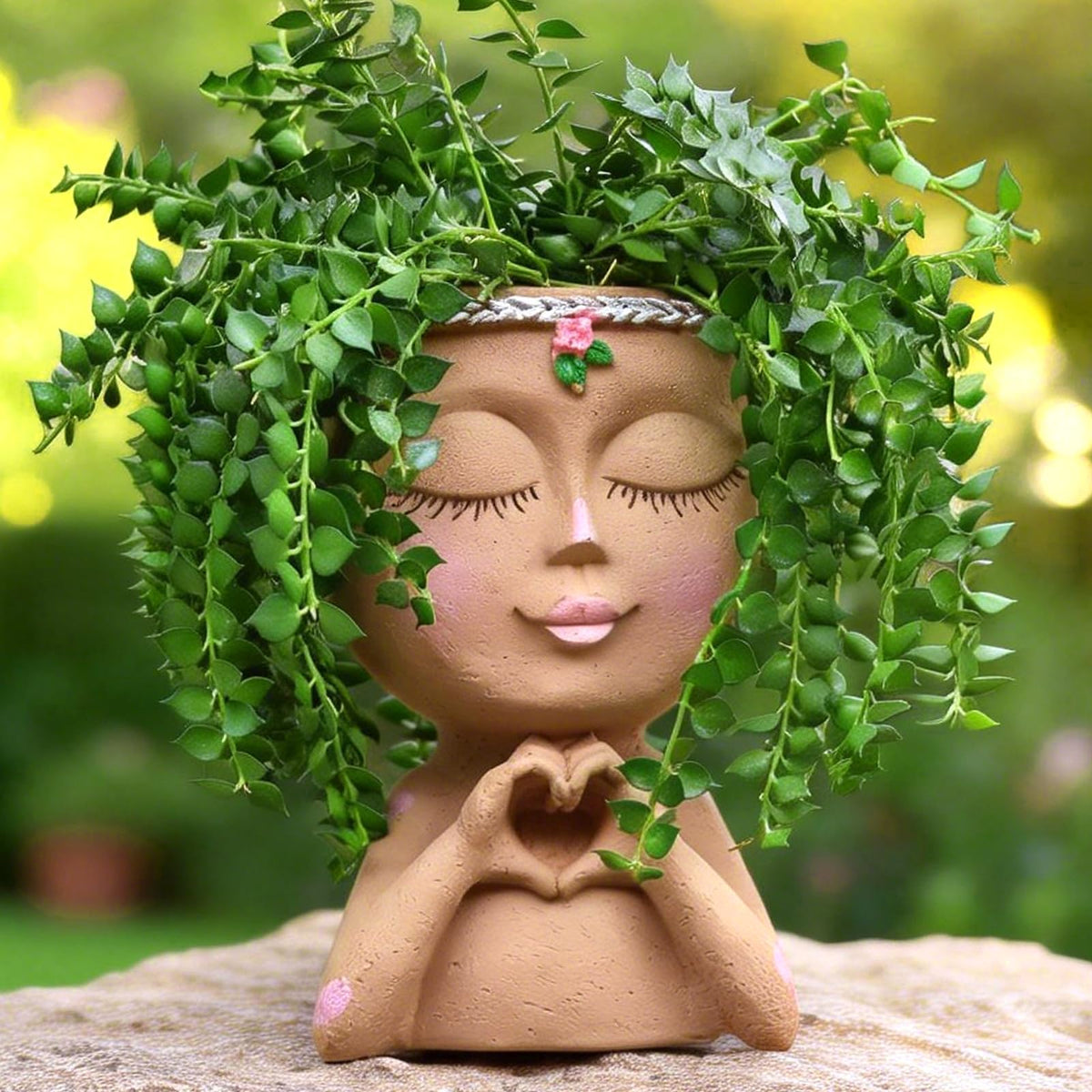 Meltset M Face Planter with Heart Hands front view adds personality to indoor decor.