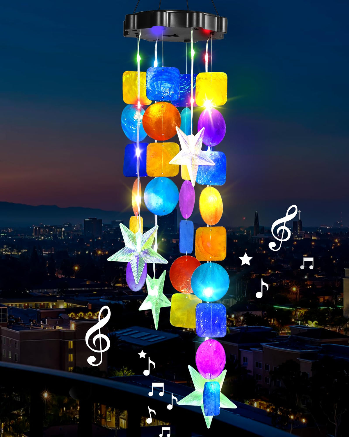 MERRIMAX M solar shell wind chimes illuminate garden at dusk for inviting outdoor ambiance.