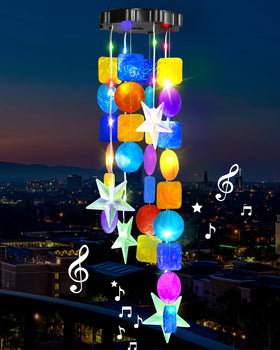 MERRIMAX M solar shell wind chimes illuminate garden at dusk for inviting outdoor ambiance.