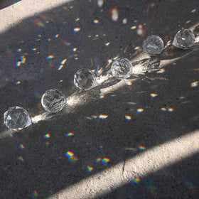 MerryNine sun catcher 20mm prisms enhance room ambiance with rainbows.
