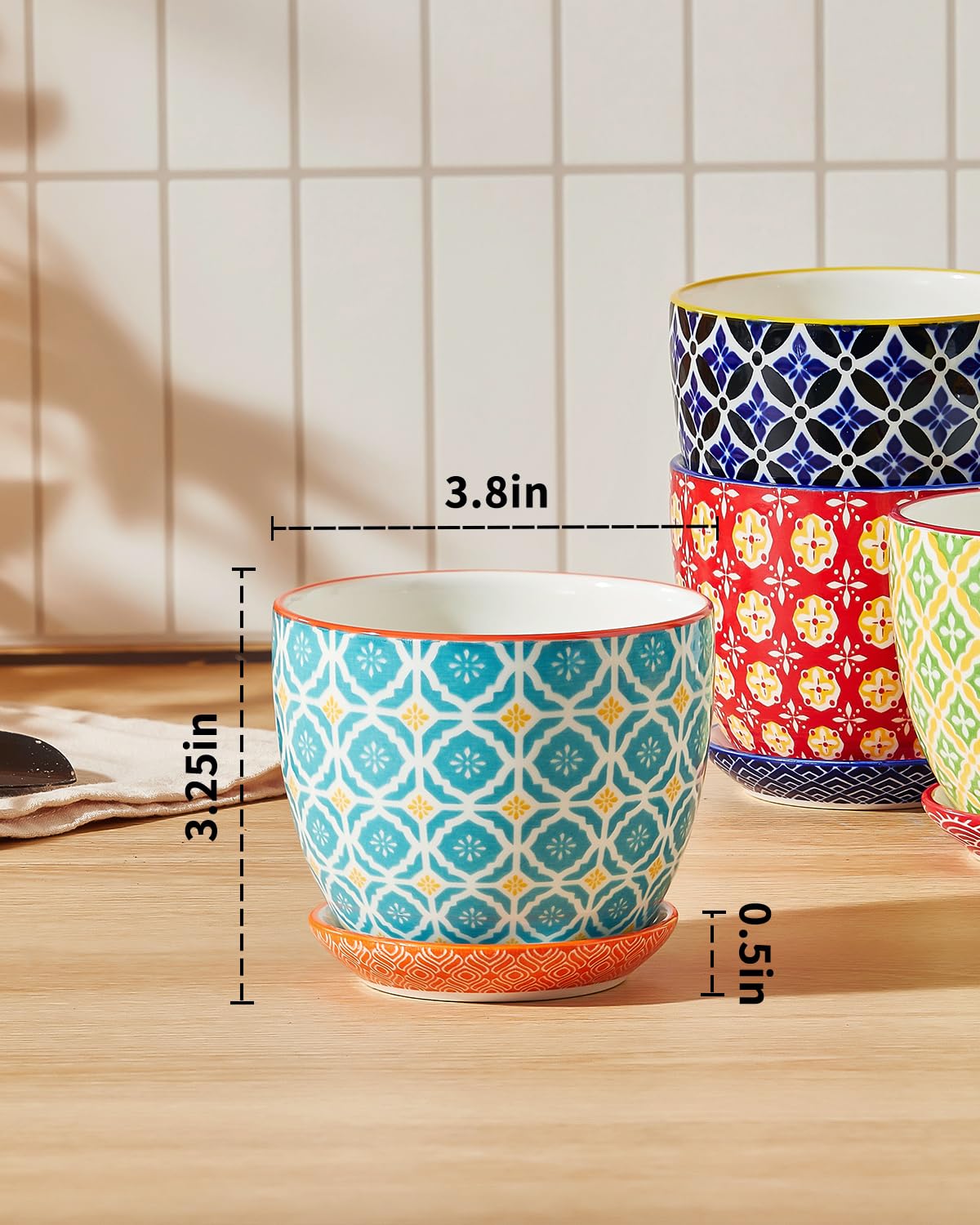 Metahom pot with saucer catches excess water to keep surfaces clean.