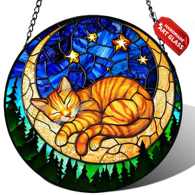 Meyocky orange sleeping cat suncatcher in a window creates warm rainbow light.