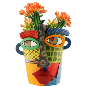 Midogaigai abstract face planter head adds playful color to indoor decor.