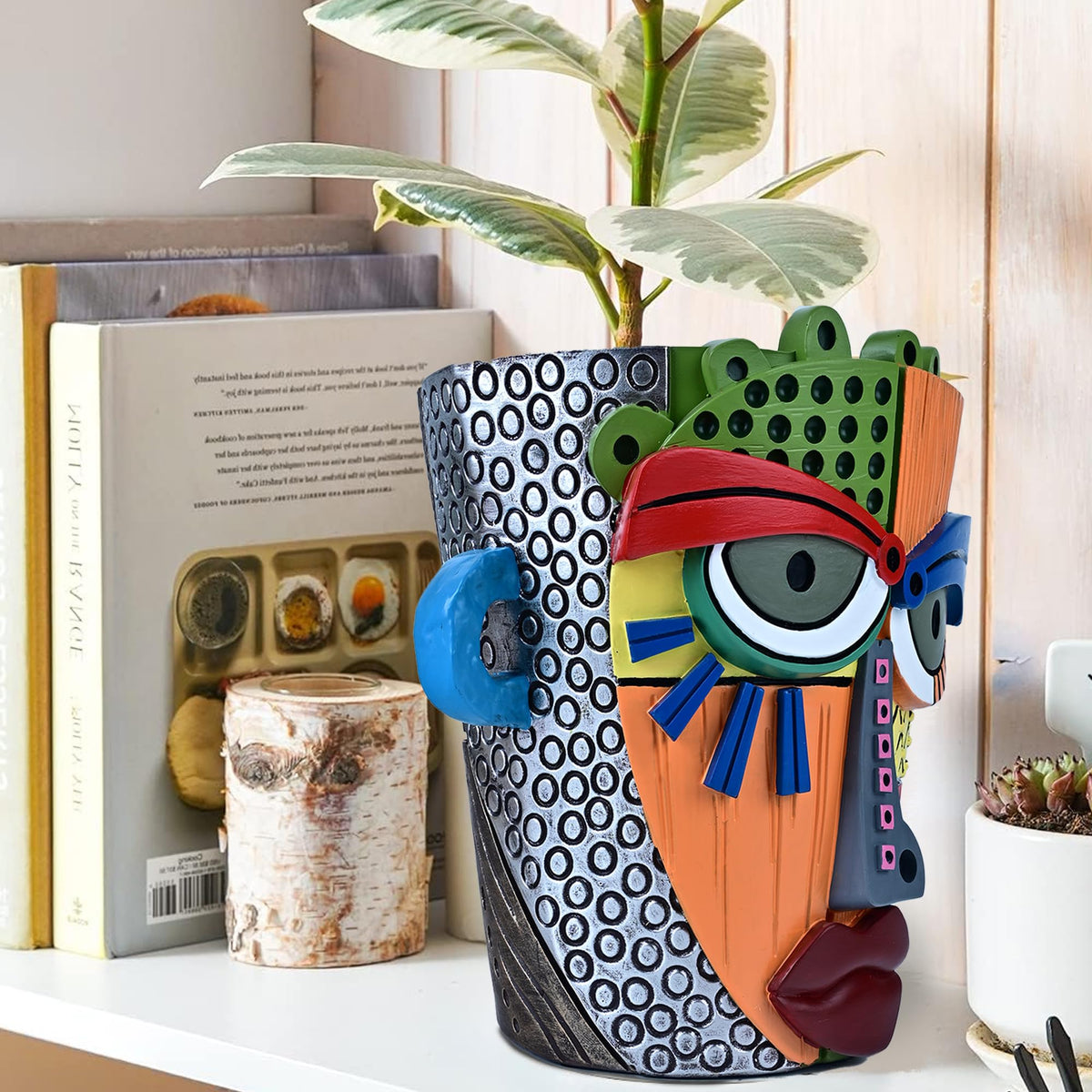 Midogaigai abstract face pot suited for indoor and outdoor decor.