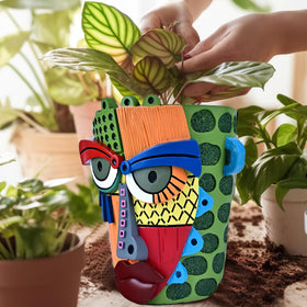 Midogaigai hand-painted face pot in colorful hues adds vibrant decor.
