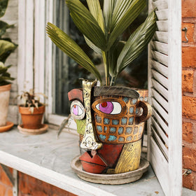 Midogaigai indoor-outdoor planter decor blends whimsy with practical plant display.