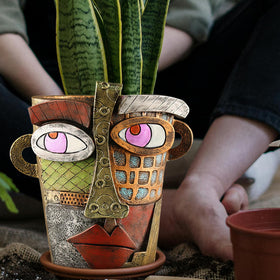 Midogaigai vibrant colors emphasize abstract art-inspired planters as focal points.