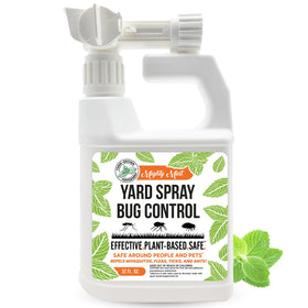 Mighty Mint lawn spray bottle applying natural pest protection outdoors.