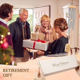 Gift-ready Milcier retirement wind chime beside a festive card