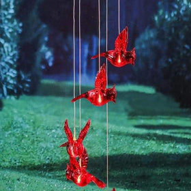 Milcraft Cardinal wind chime brightening garden path at dusk