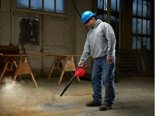 Milwaukee 0884-20 M18 leaf blower showing compact design for one-handed use.