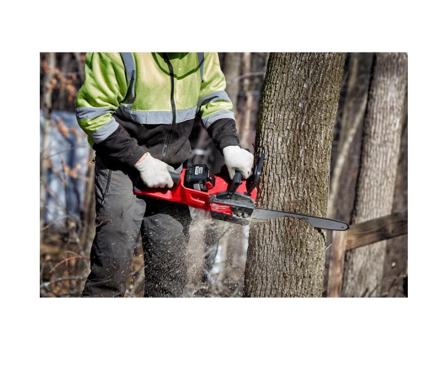 Milwaukee chain in action cutting with saw and visible chips.