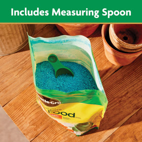 Miracle-Gro plant food dissolving in water for easy application.