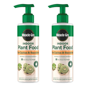 Miracle-Gro Indoor Plant Food bottle pour for easy succulent feeding.