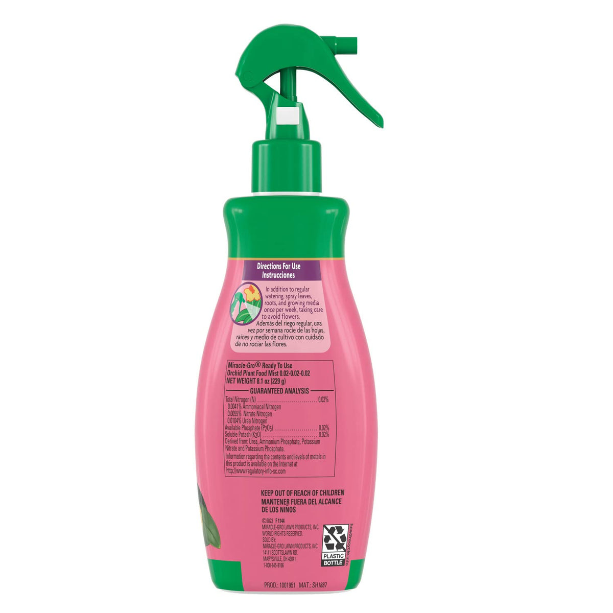 Spraying orchid leaves with Miracle-Gro Mist for quick nourishment.