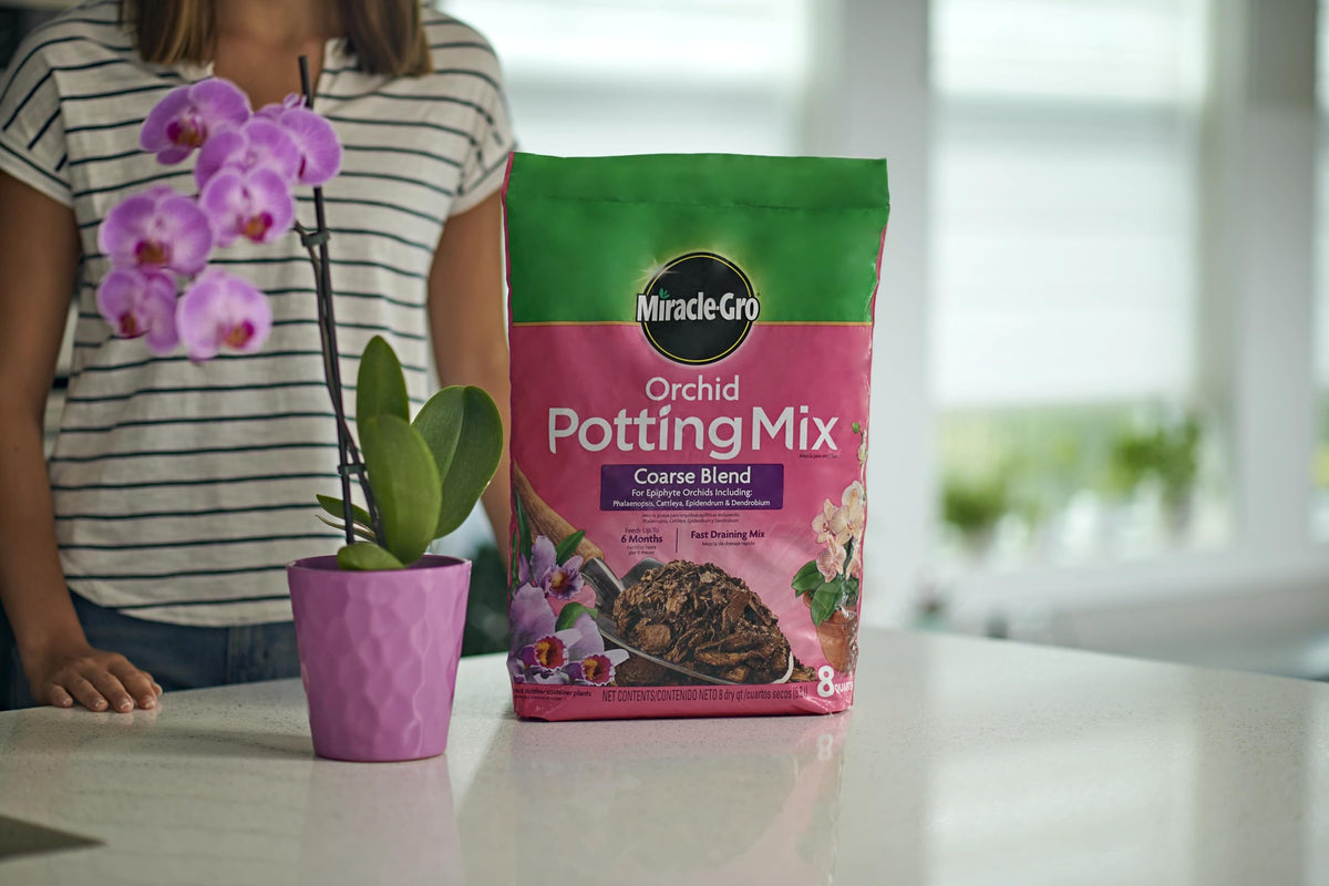 Miracle-Gro Orchid Potting Mix Coarse promoting healthy blooms potential.